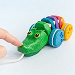 Rainbow Alligator pull-along - Plan Toys